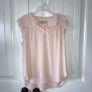 Women’s light pink ruffle sleeveless blouse